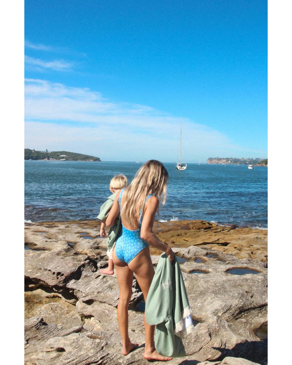 Model wearing Sage Hooded Towel