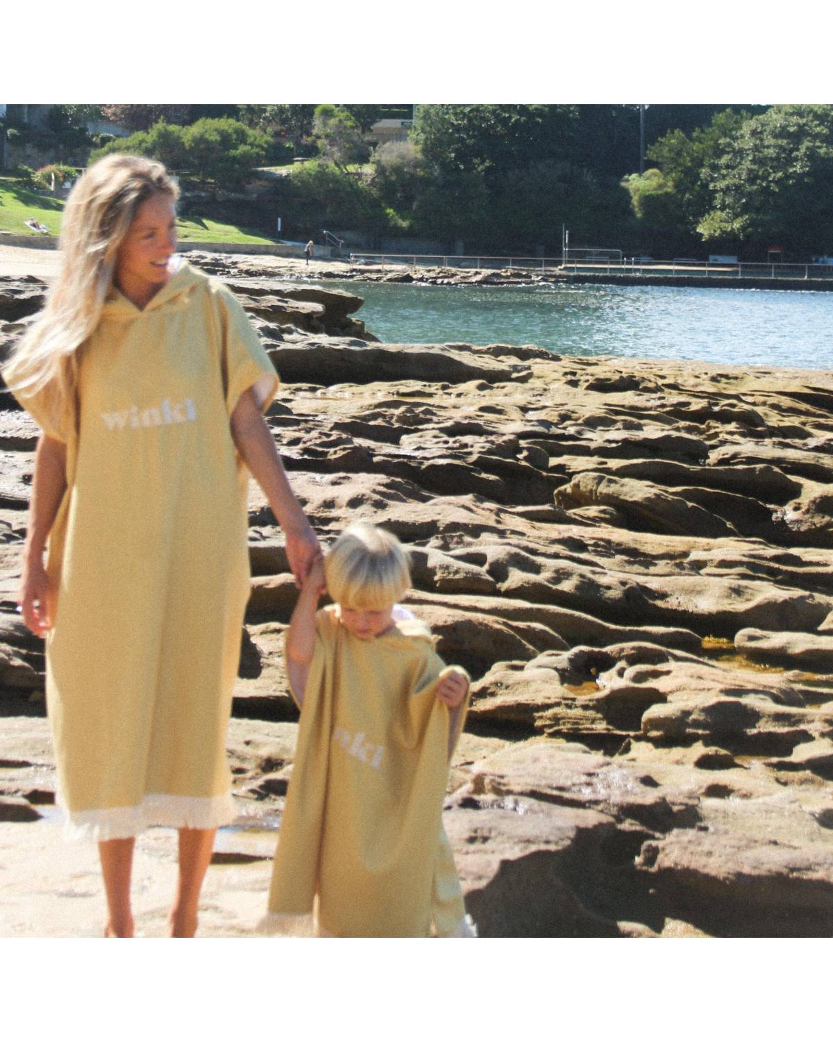 Woman wearing mustard hooded towel