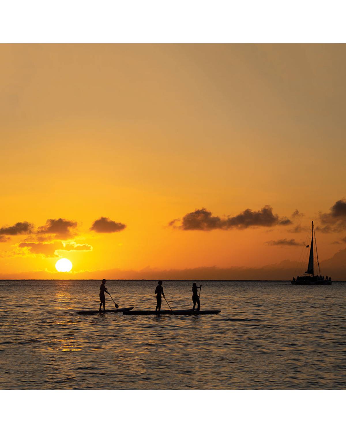 Paddleboarding at sunset