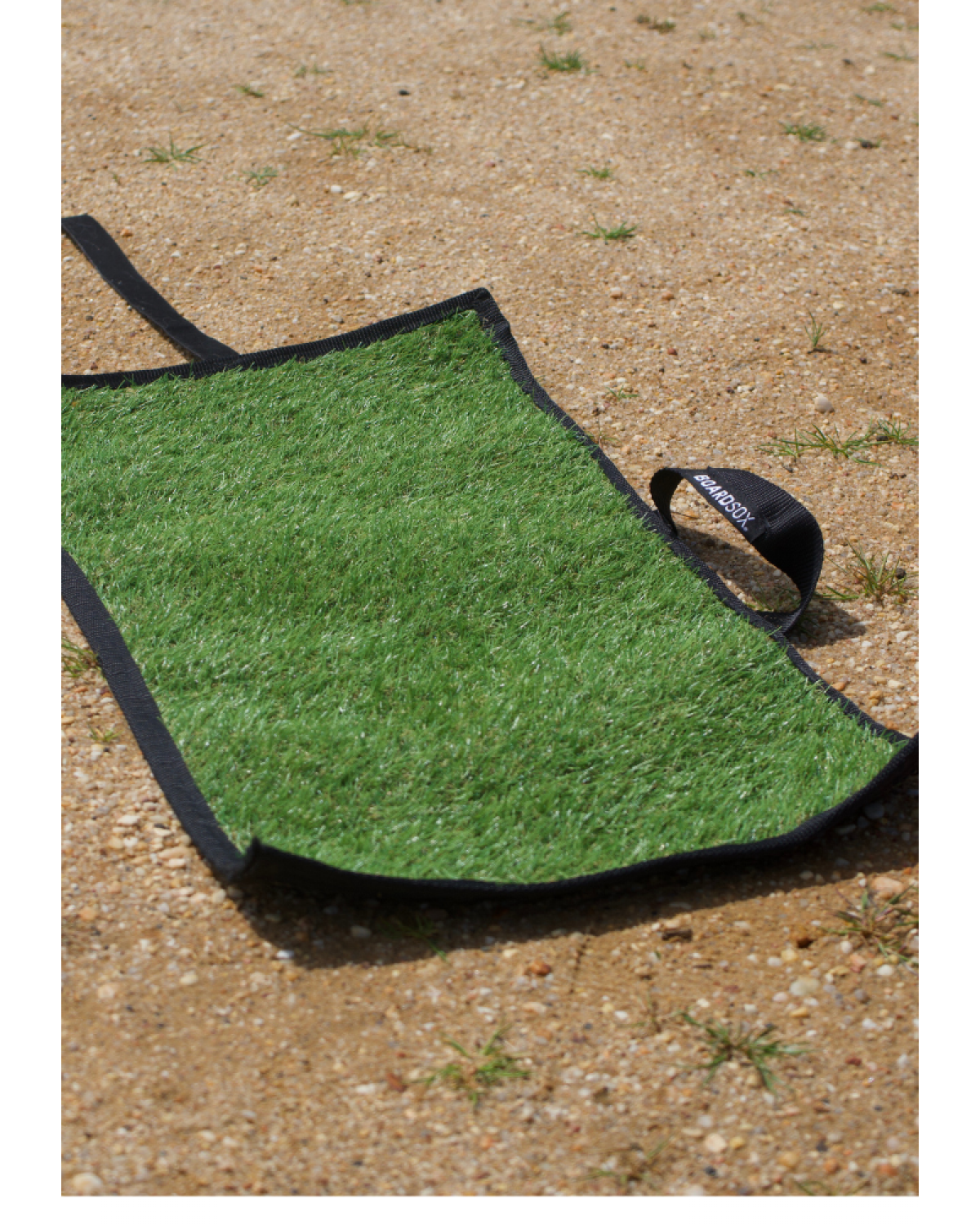 Rolled sand mat on grass