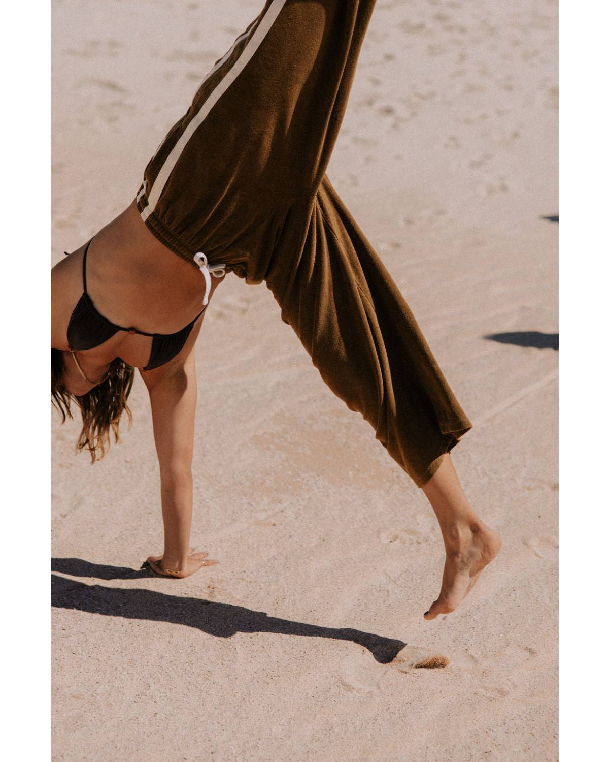 Green pants on model, side view