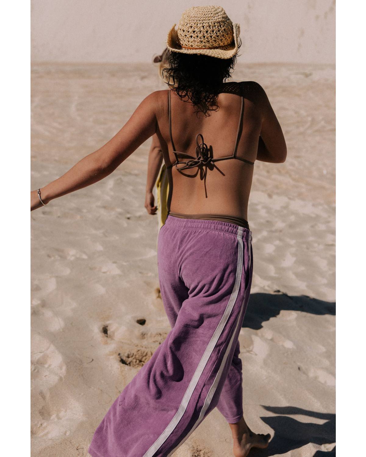 Model sitting on sand