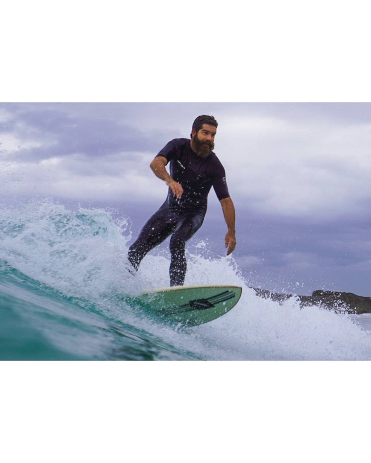 Attica Omega 3/2 Chest Zip S/S Steamer - Black/White on model in action