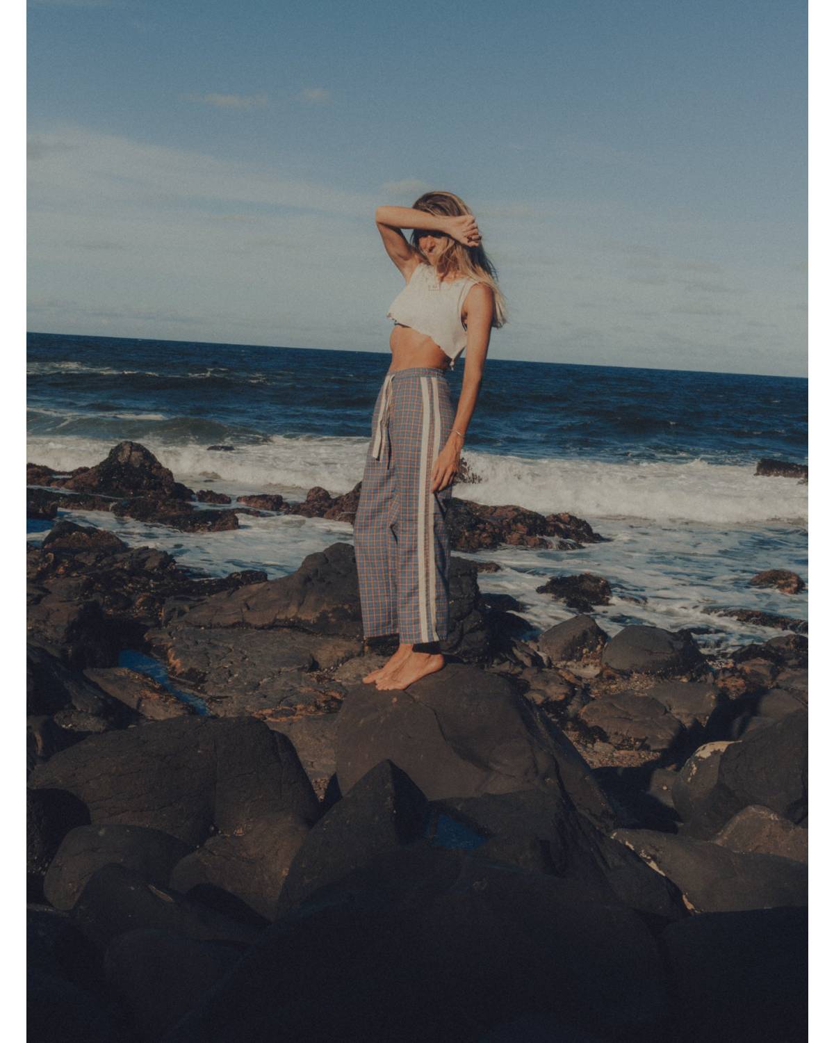 Flannel pants on rocks standing