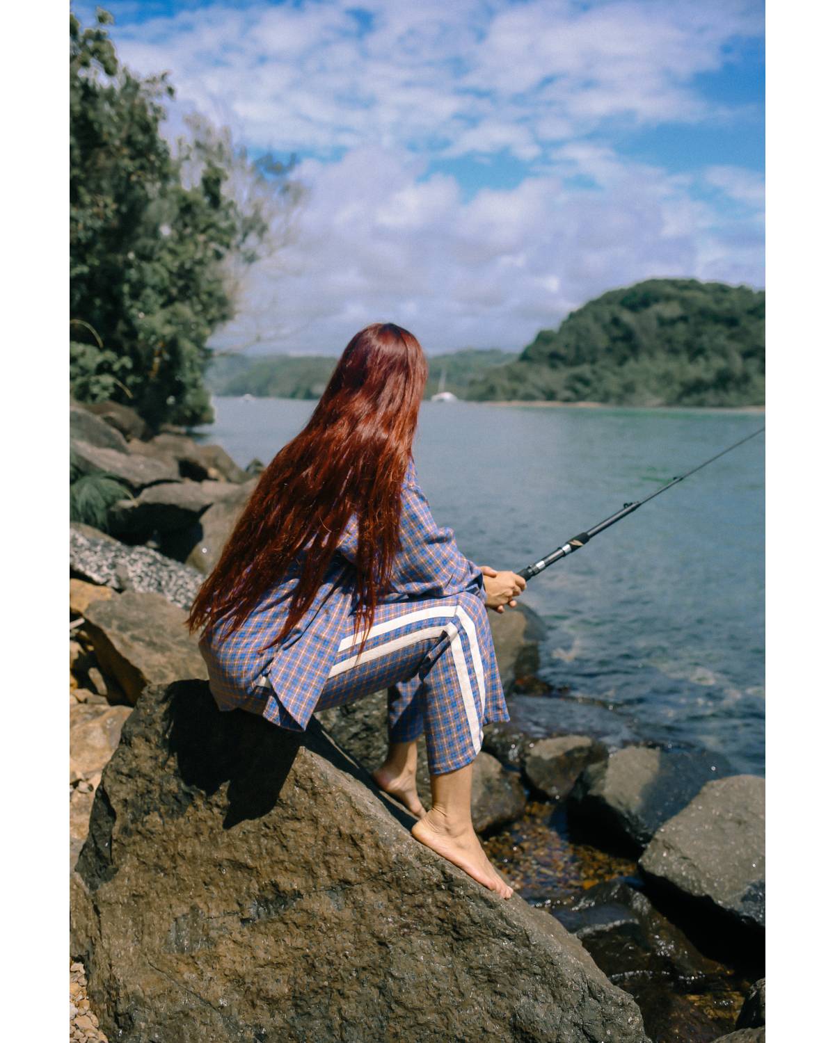 Flannel pants fishing by river