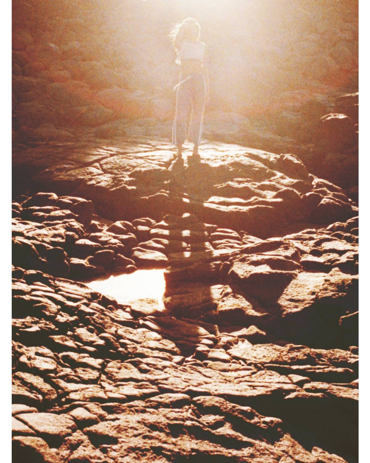 Flannel pants on rocks with ocean