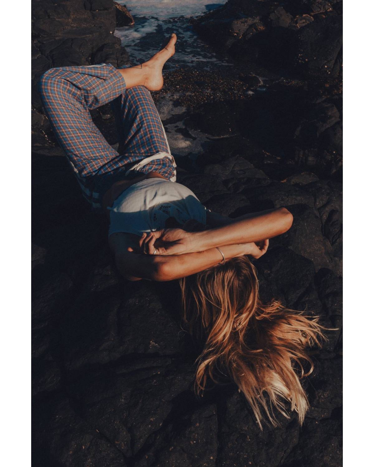 Flannel pants lying on rocks