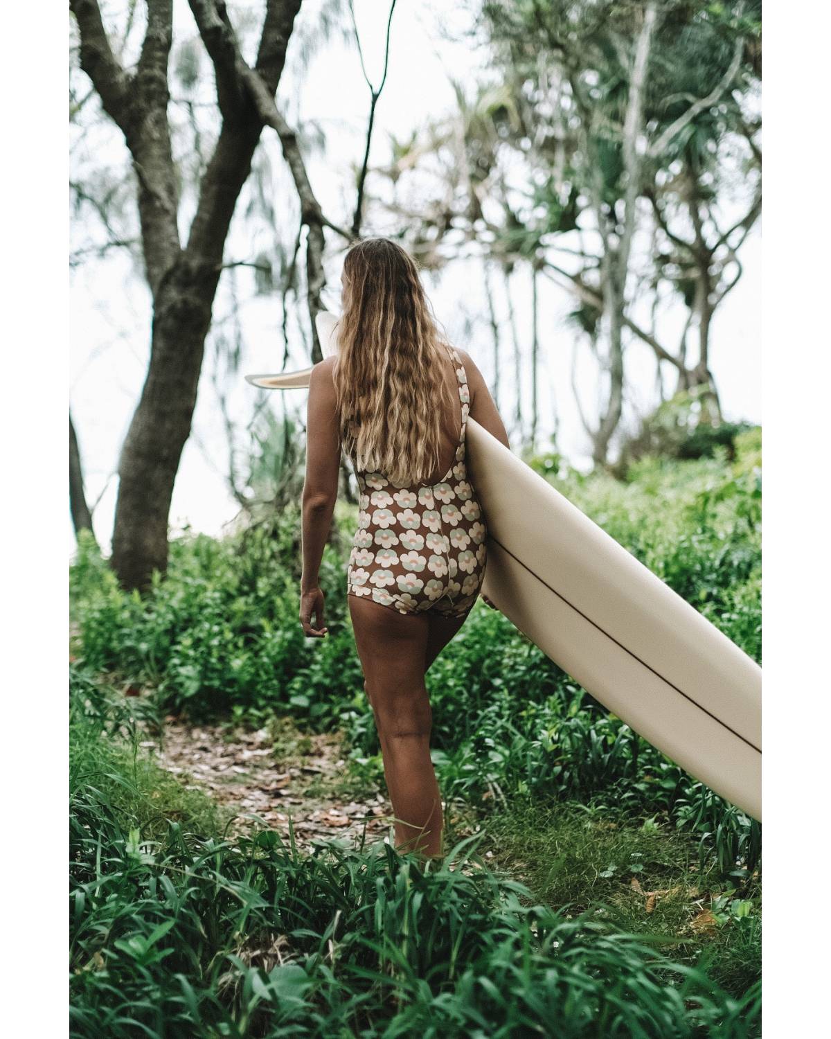 Back view with surfboard