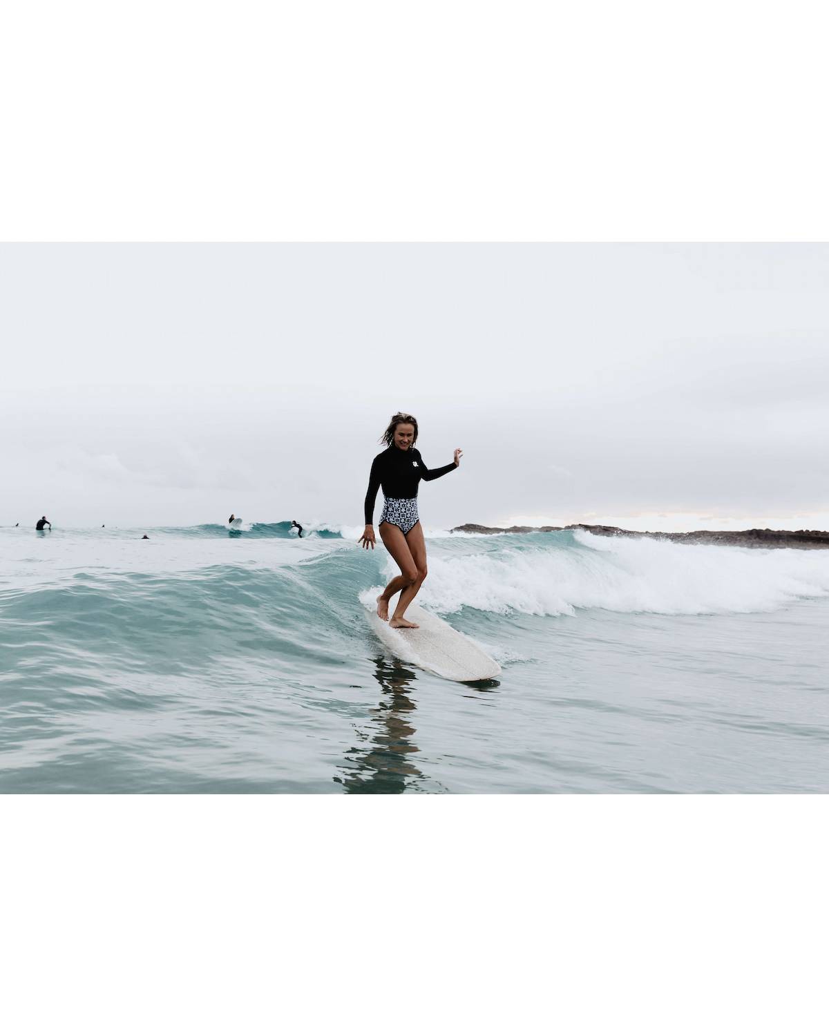 Inner Relm Daisy Venom 2mm Springsuit - Chequer model in action