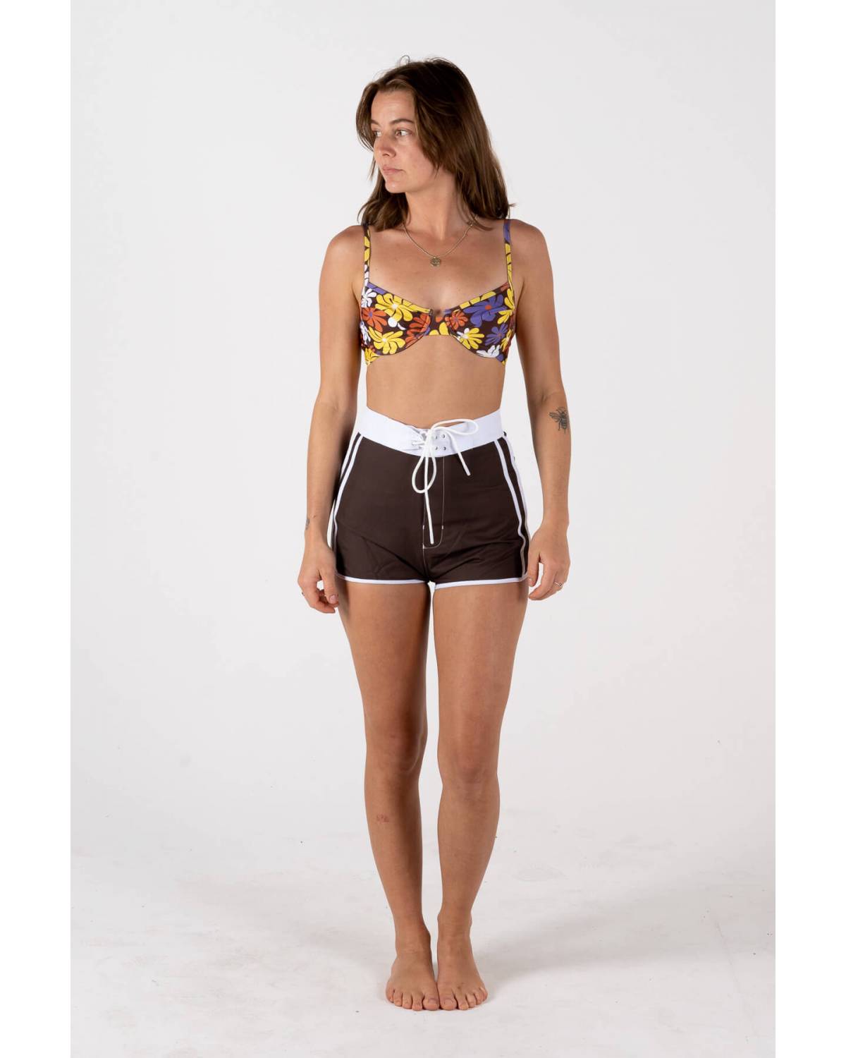Front view of model wearing boardshorts