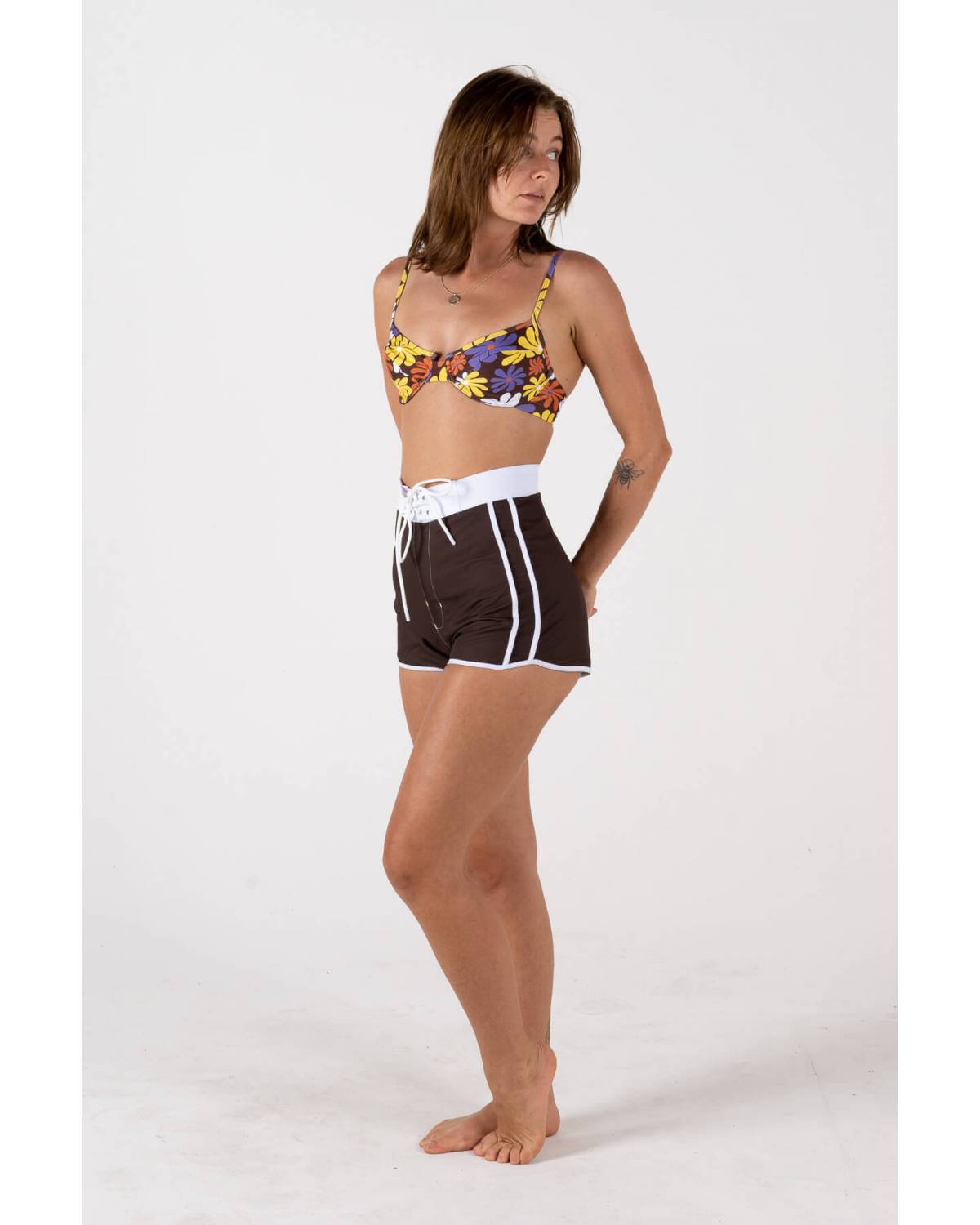 Side view of model wearing boardshorts