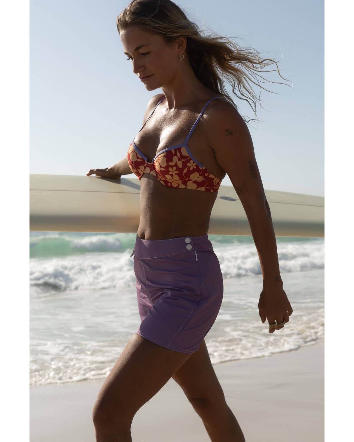Walking on beach with board