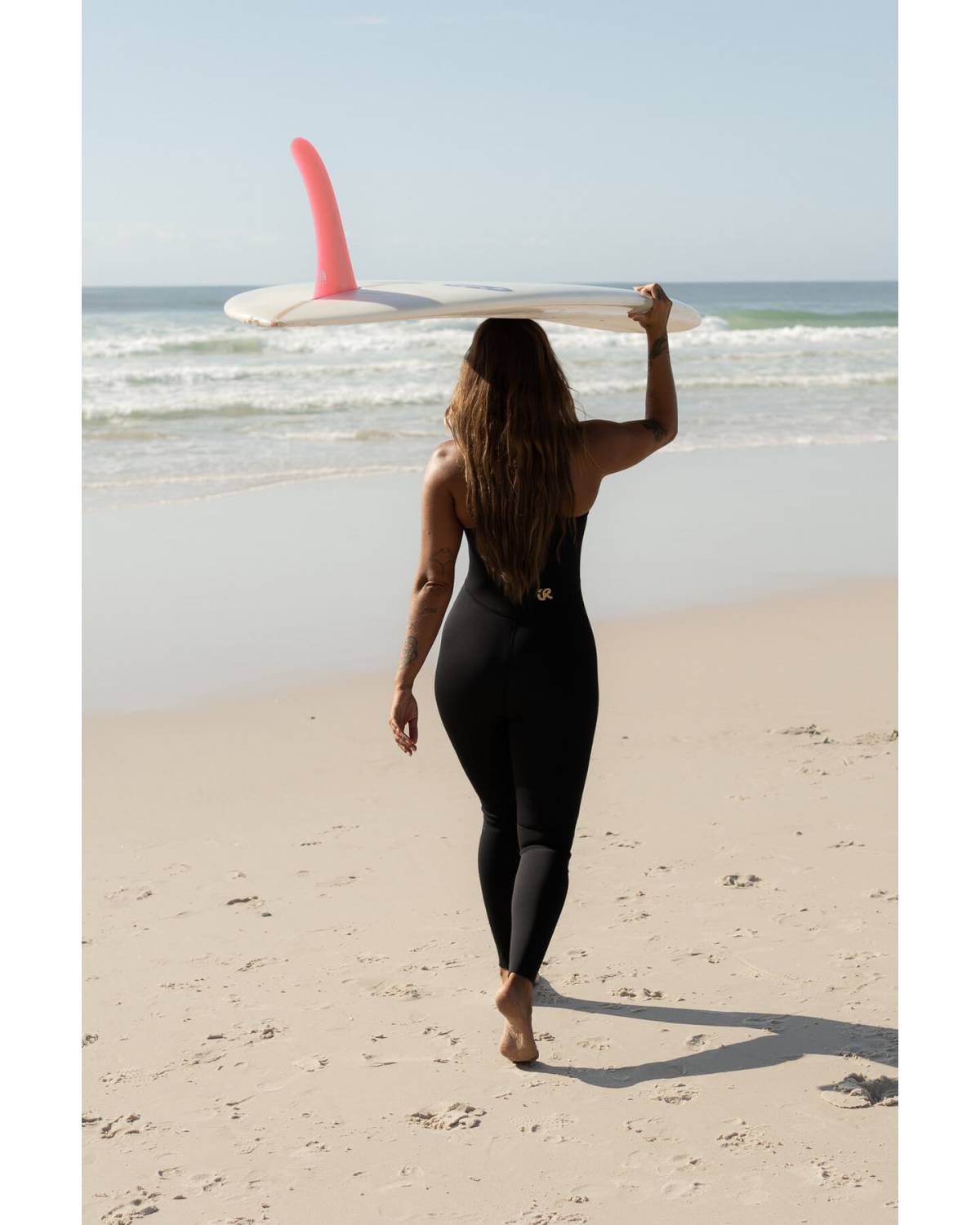 Model standing on beach