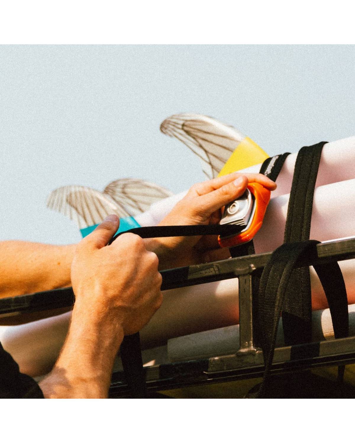 Kanulock Lockable Tiedowns securing surfboards