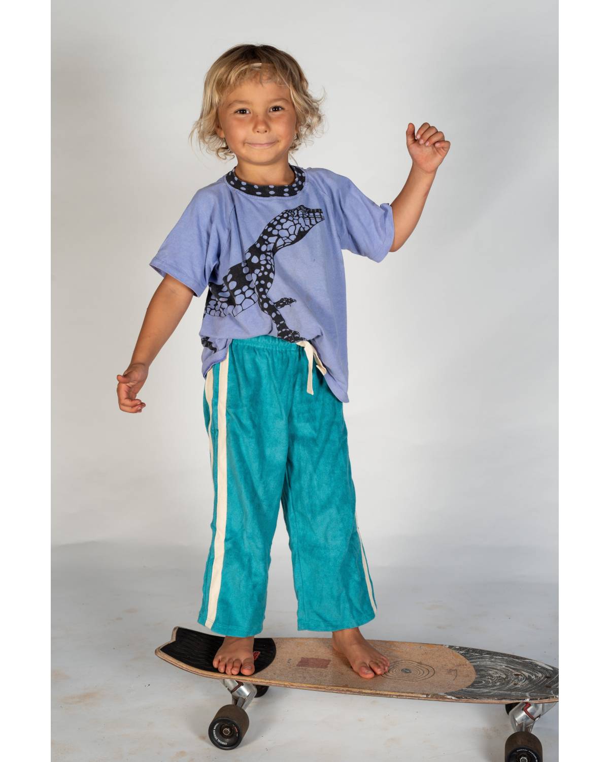 Child lying on skateboard