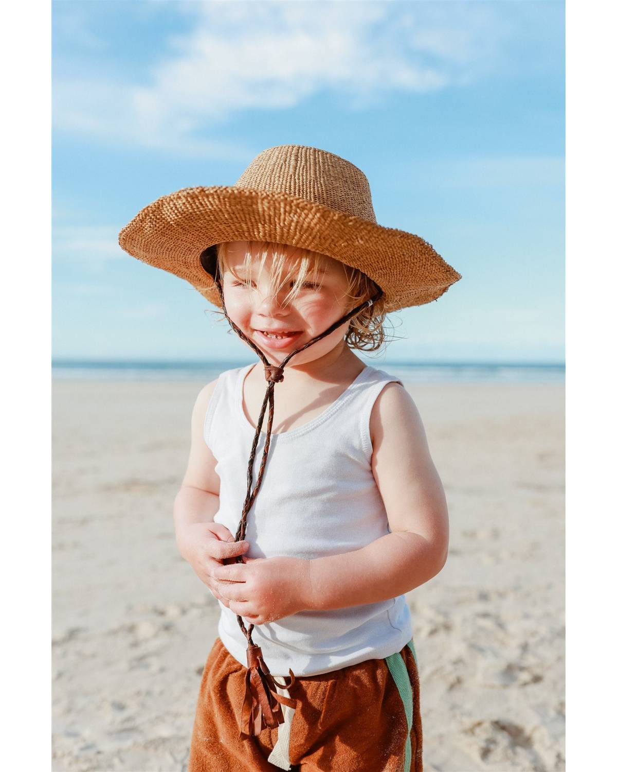 Child with hat smiling