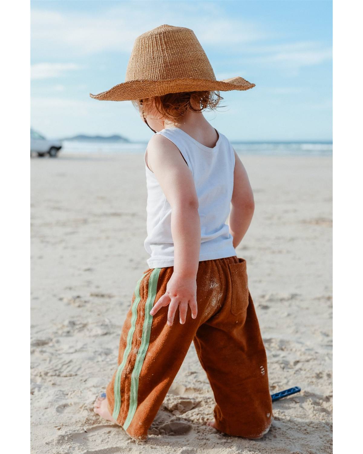 Child with hat looking sideways