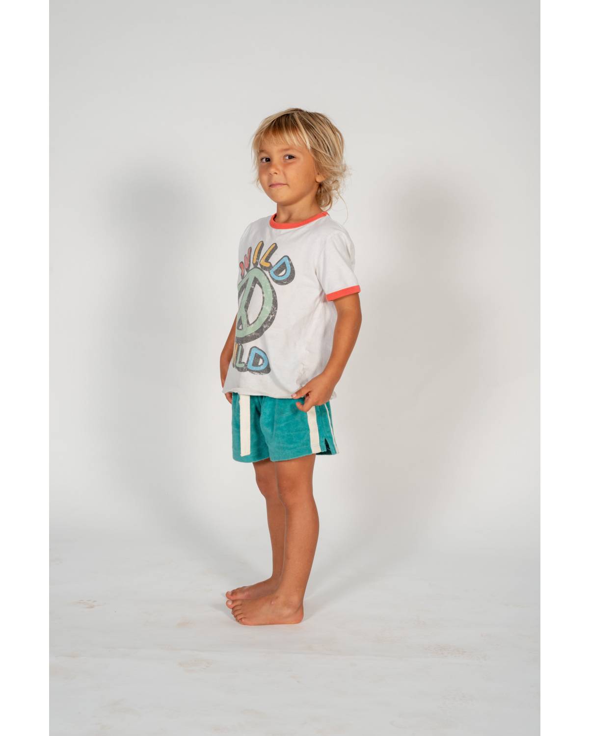 Child on skateboard lying down
