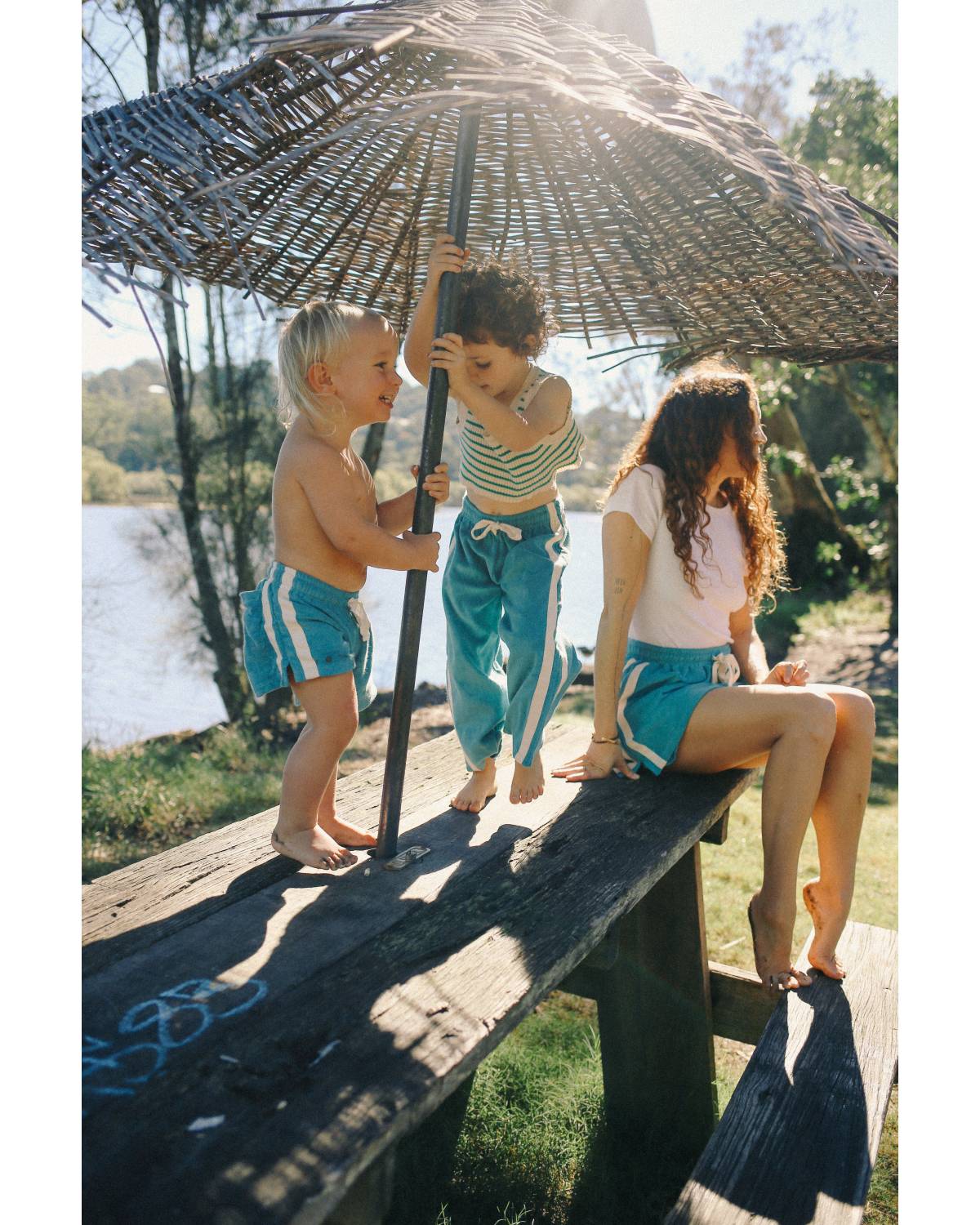 Children under umbrella outdoors