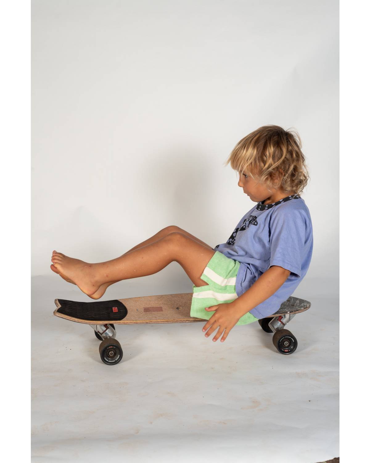 Mint shorts on skateboard sitting