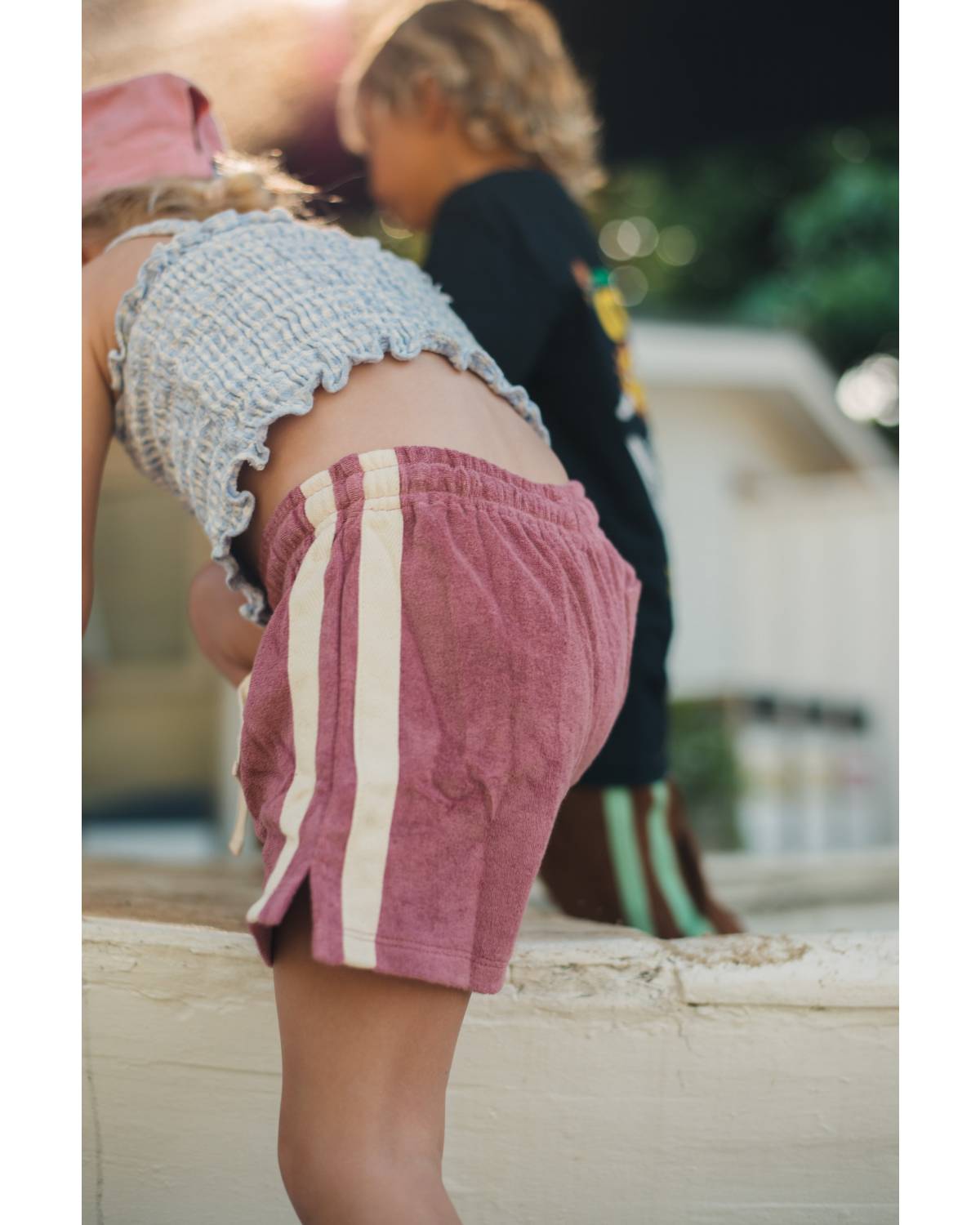 Child sitting with legs up