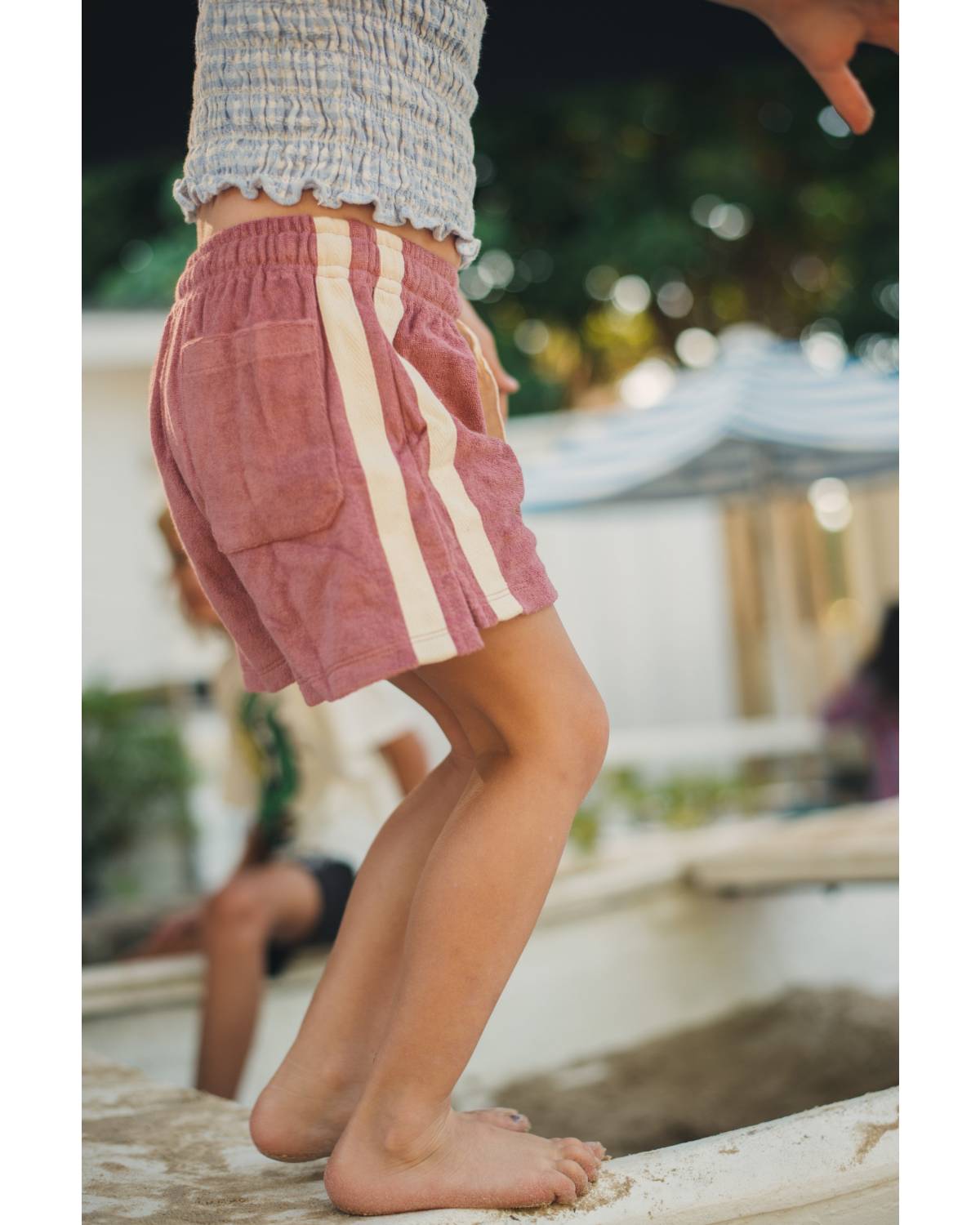 Child balancing on boat