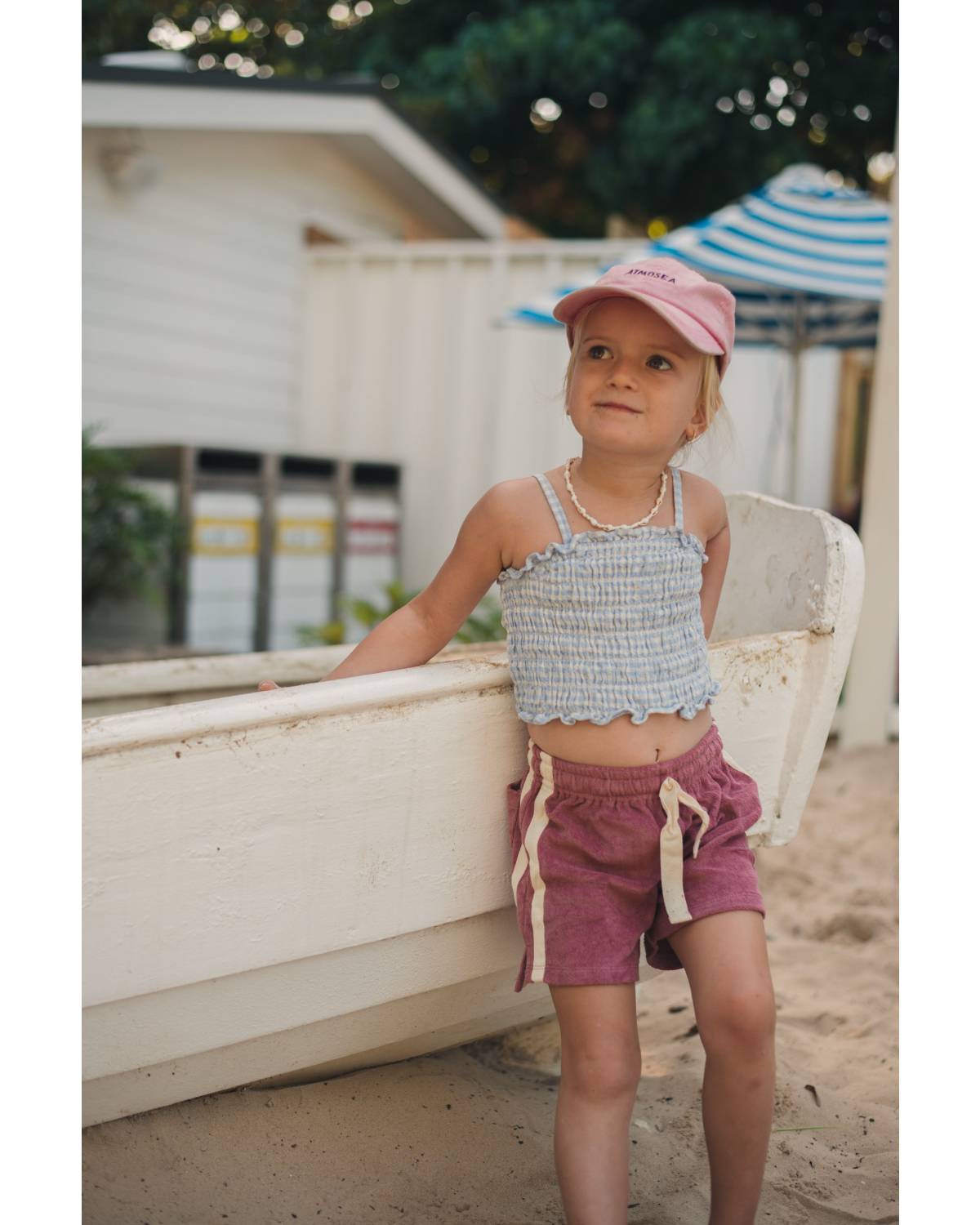 Child standing by boat