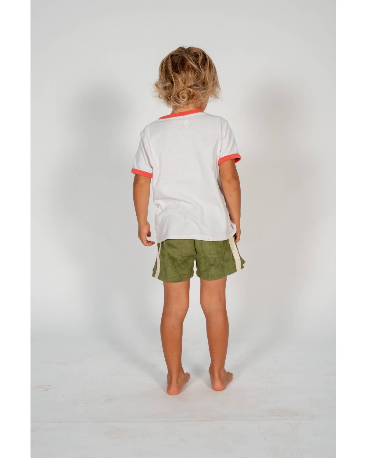 Child wearing shorts back