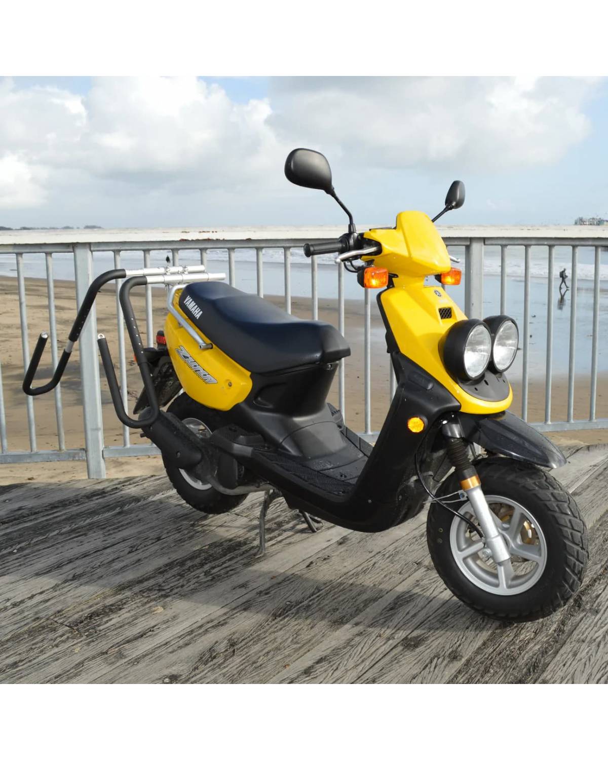 moved by bikes moped  surfboard rack side