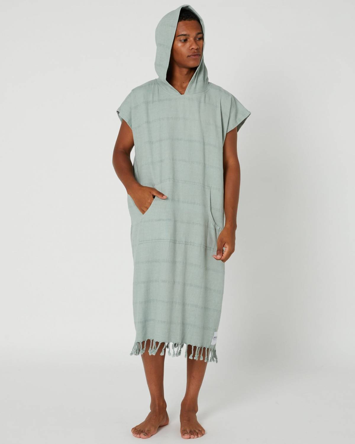 Model wearing poncho hood up
