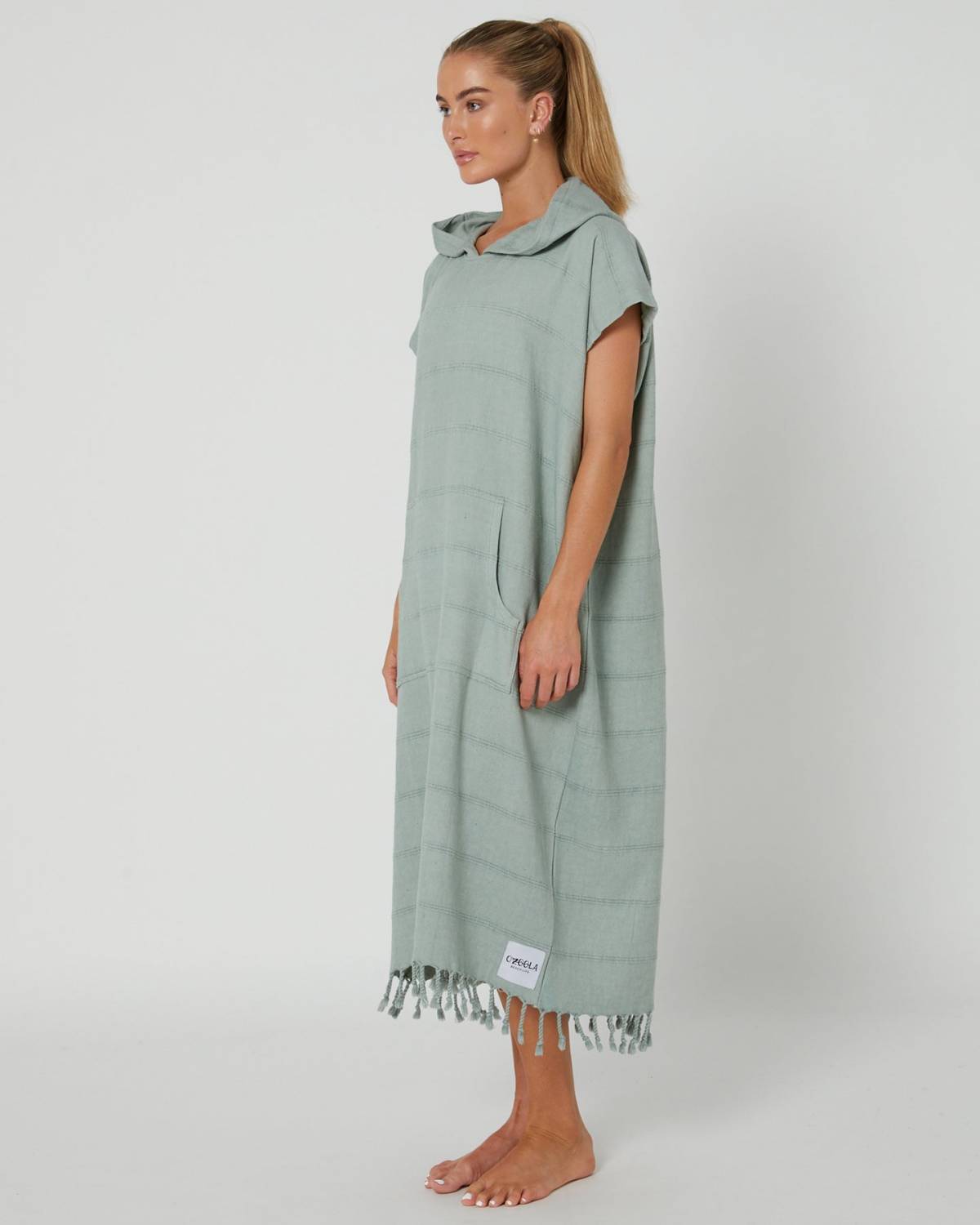 Model wearing poncho side view