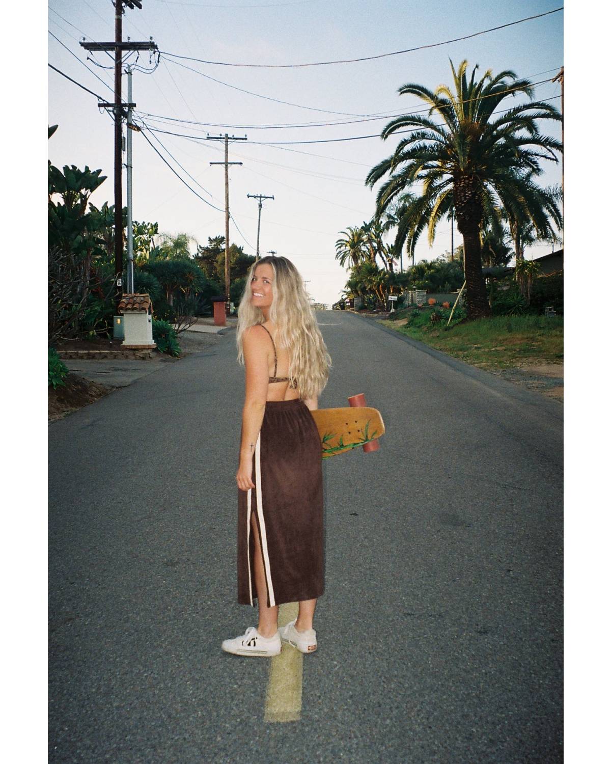 Skirt with skateboard on road