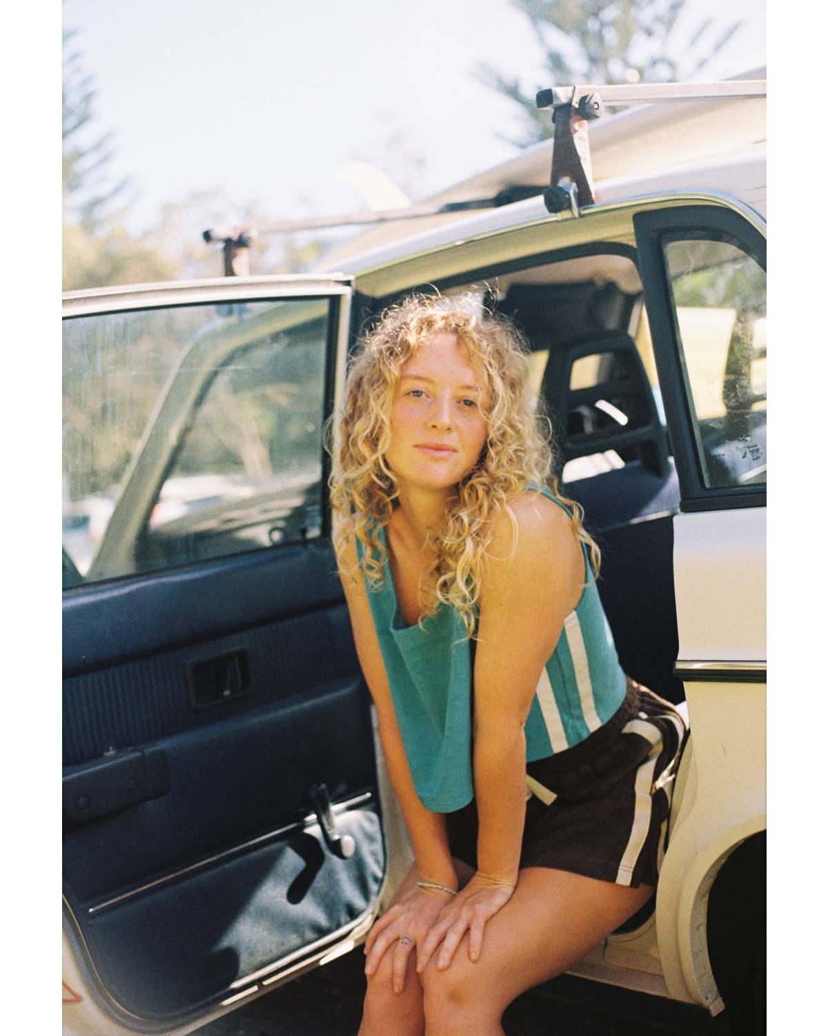Model sitting in car door