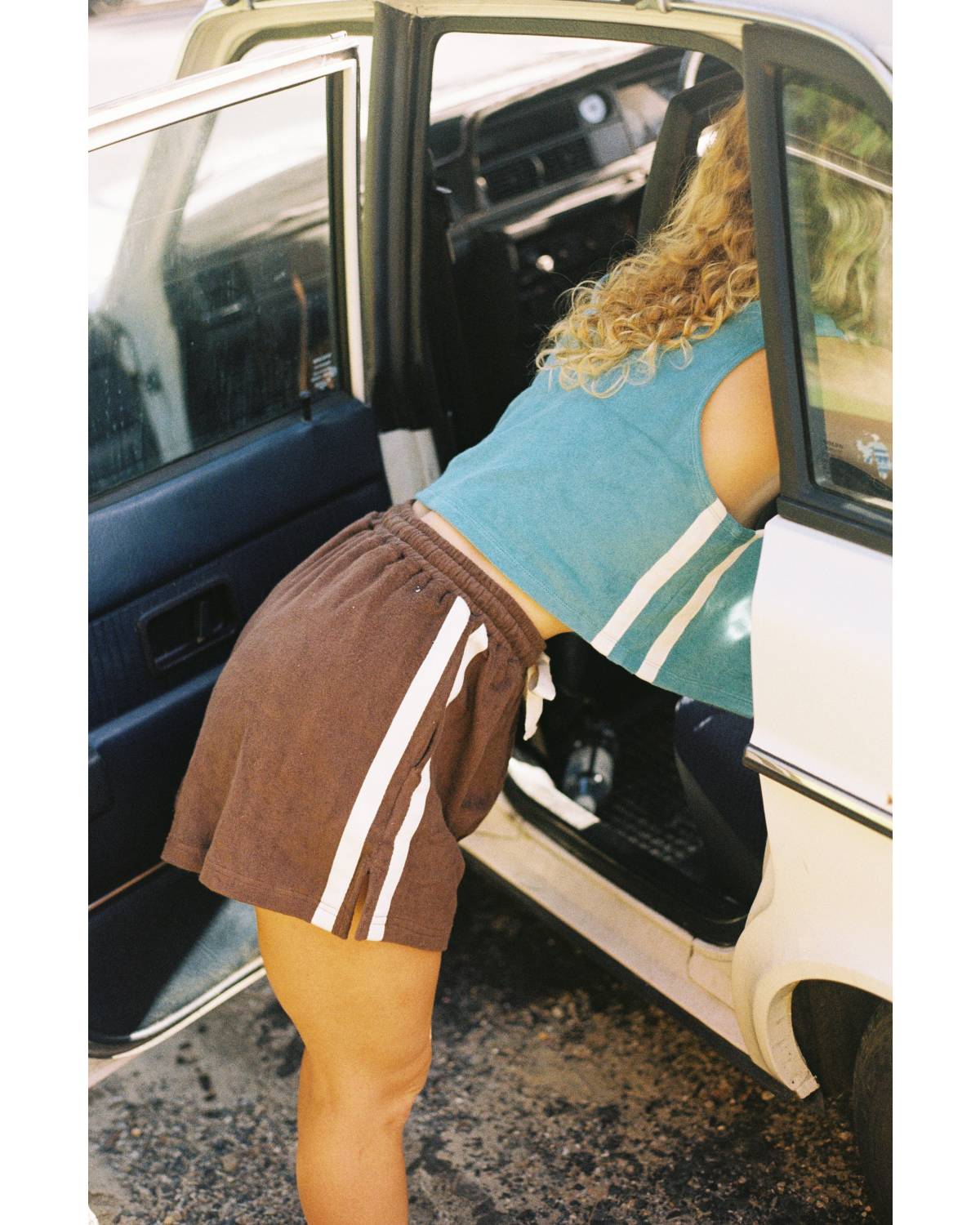 Model leaning into car