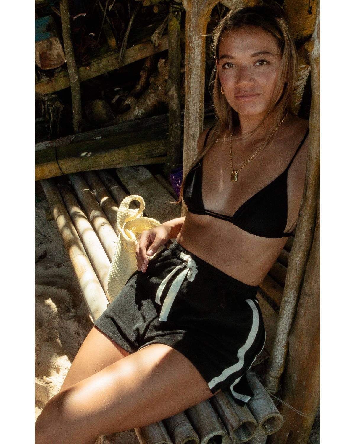 Model sitting on beach