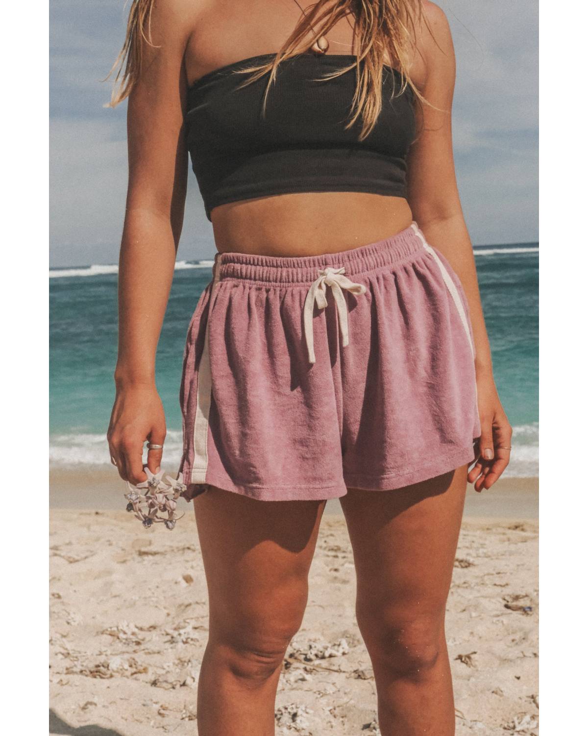 Model with friend on beach