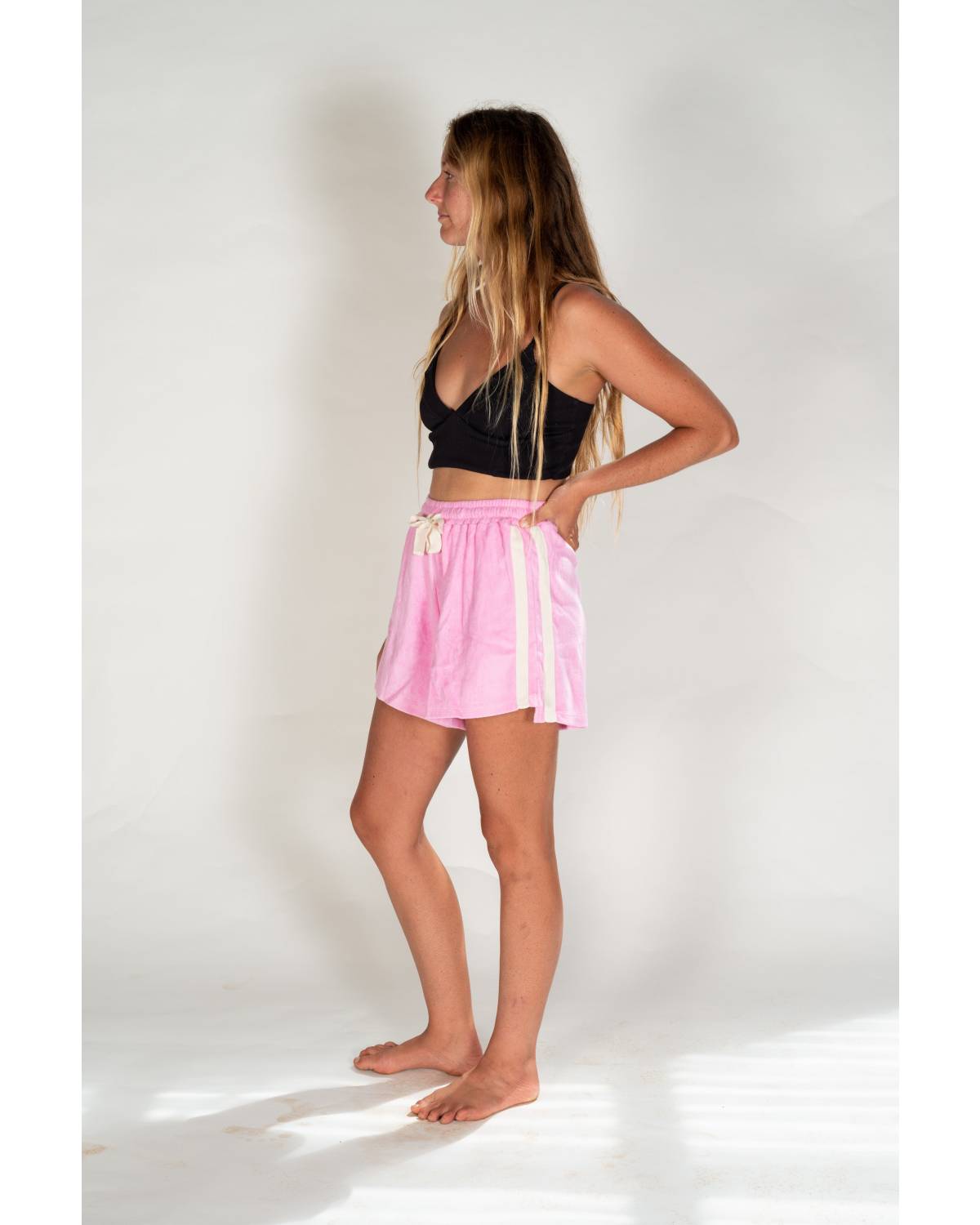 Side view of pink terry shorts