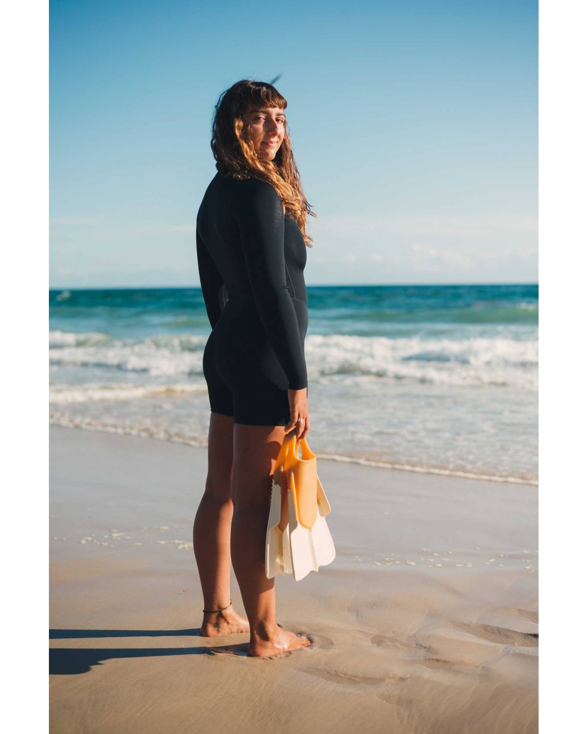 Wetsuit on beach looking back