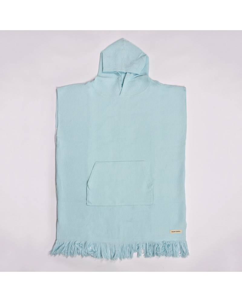 Flat lay of Bleached Aqua Poncho