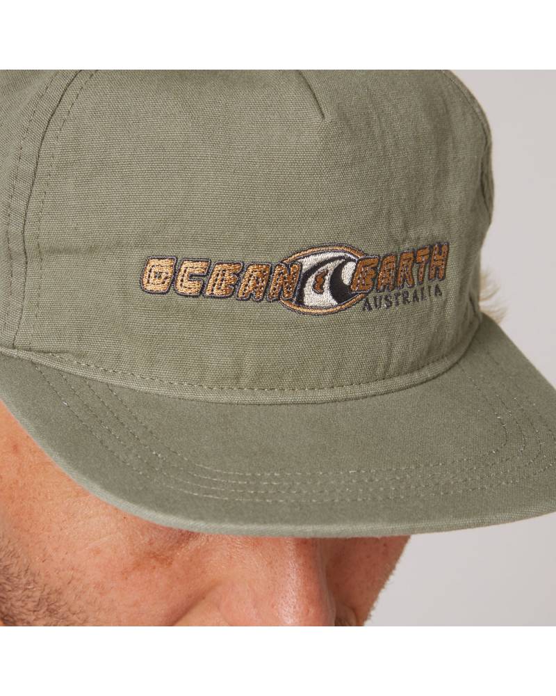 Close-up of Olive Nineties Wave Cap logo
