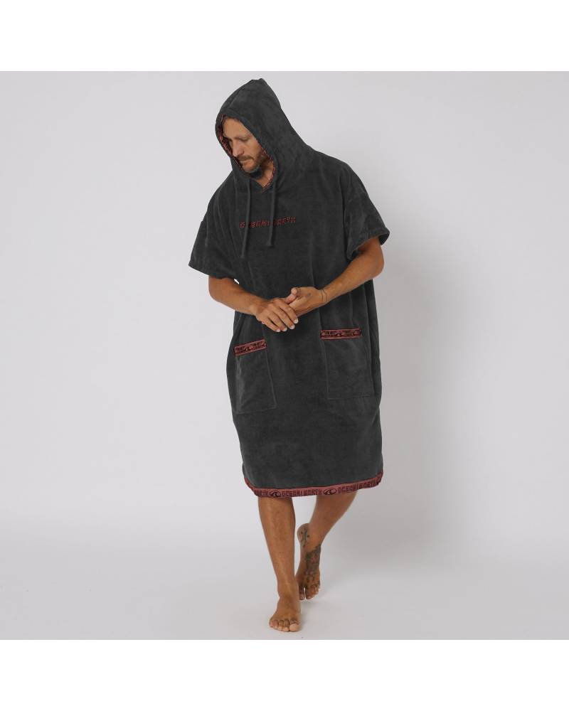 Model wearing dull black poncho