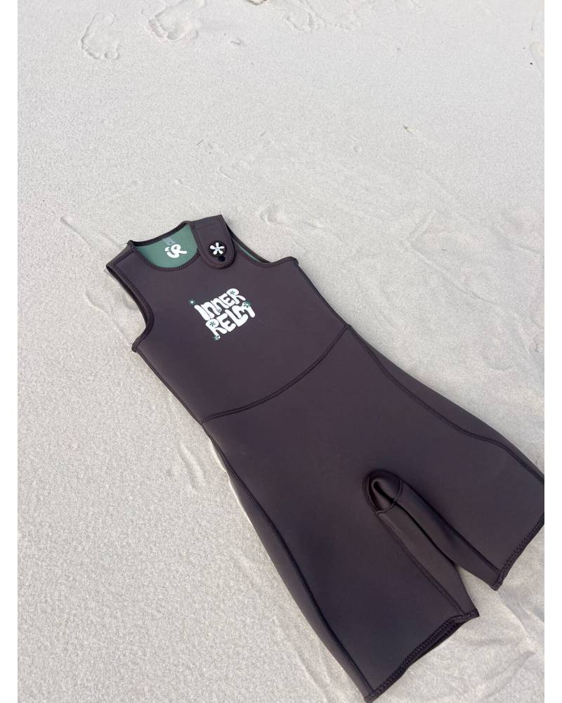 Green wetsuit beach view