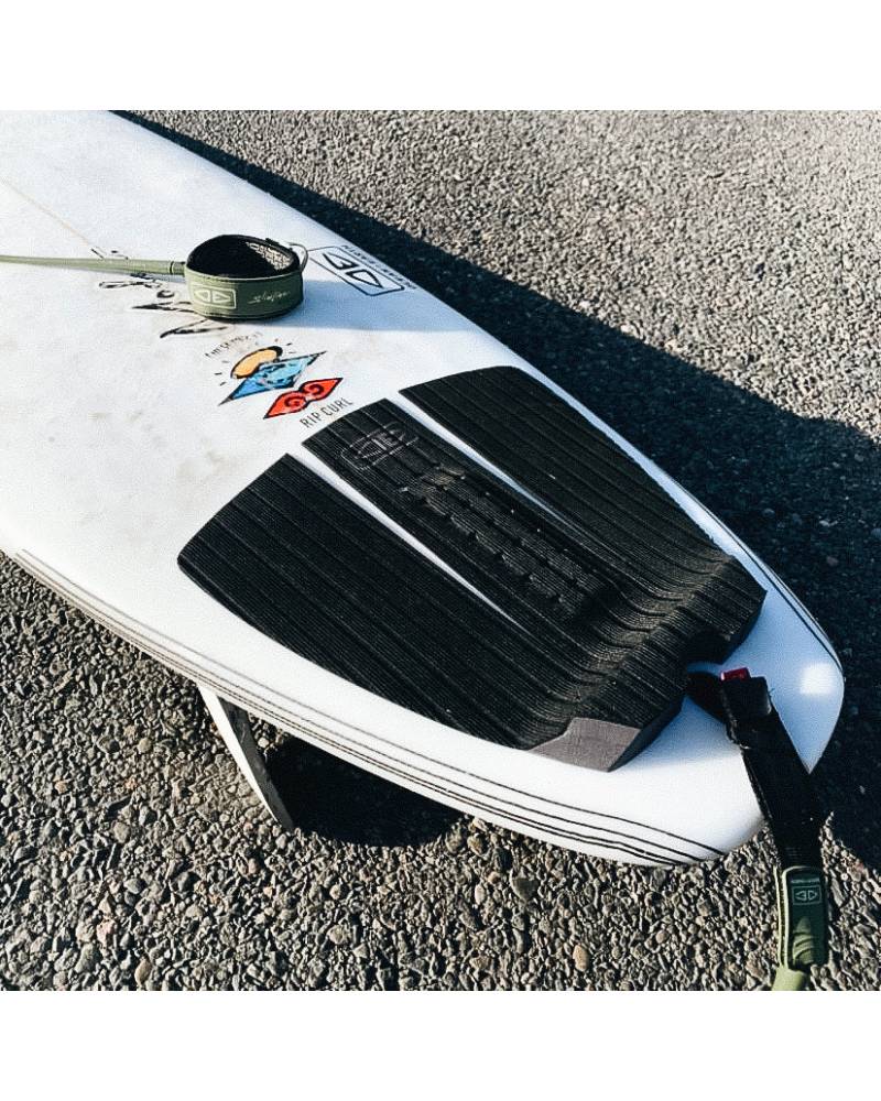 Tail pad on surfboard on beach