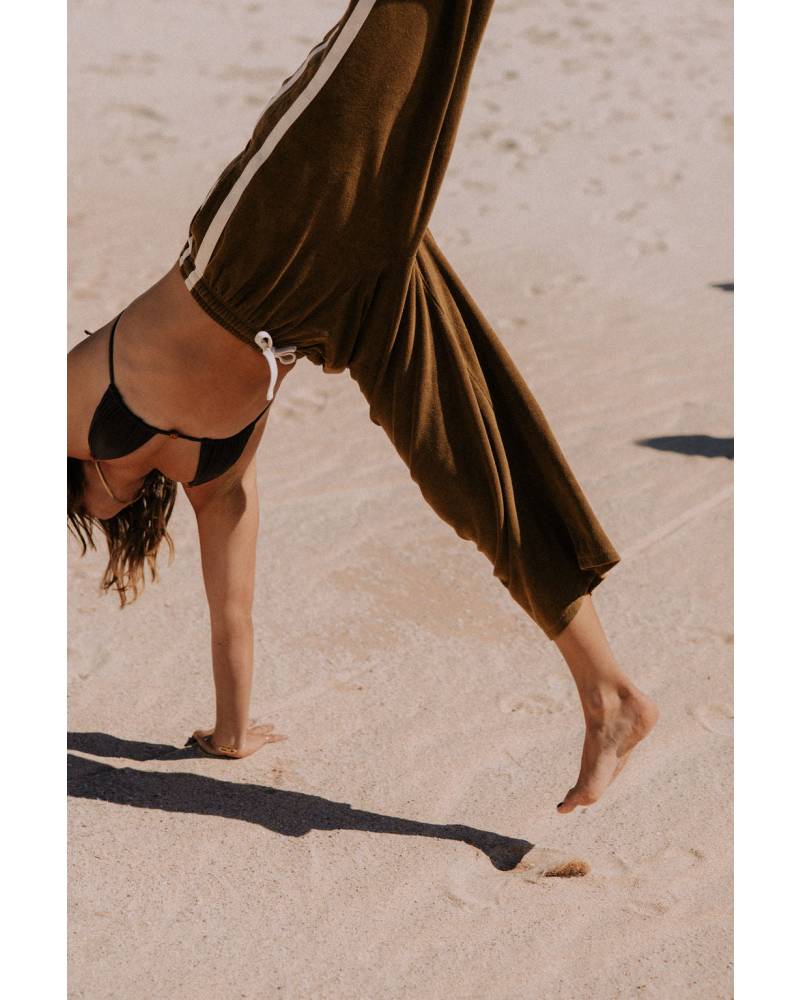 Green pants on model, side view