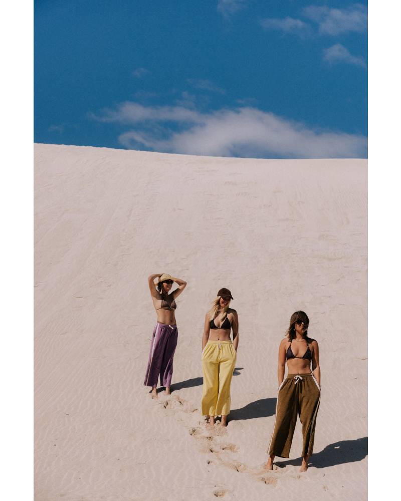 Models walking on sand dunes