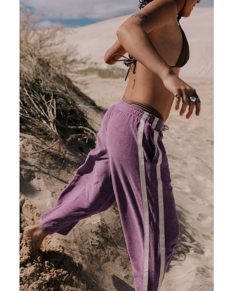 Model running in purple pants
