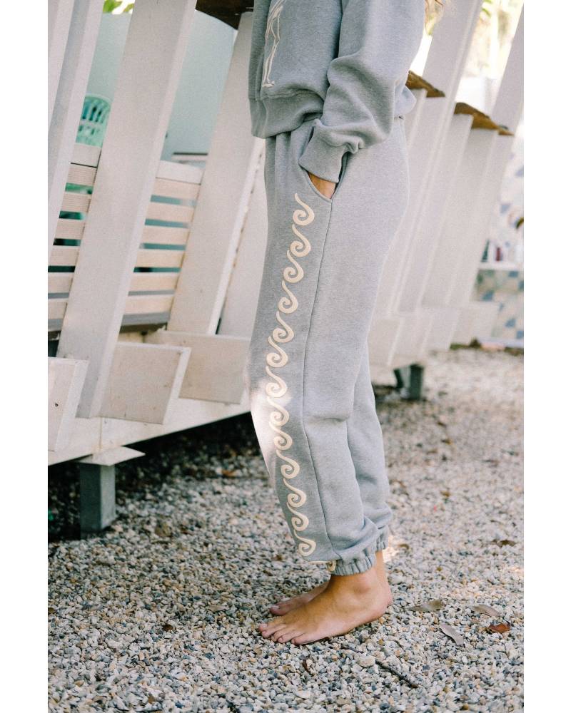 Model sitting in Bush Woman Track Pant