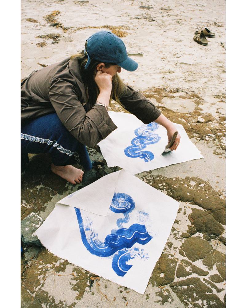 Cap with woman painting