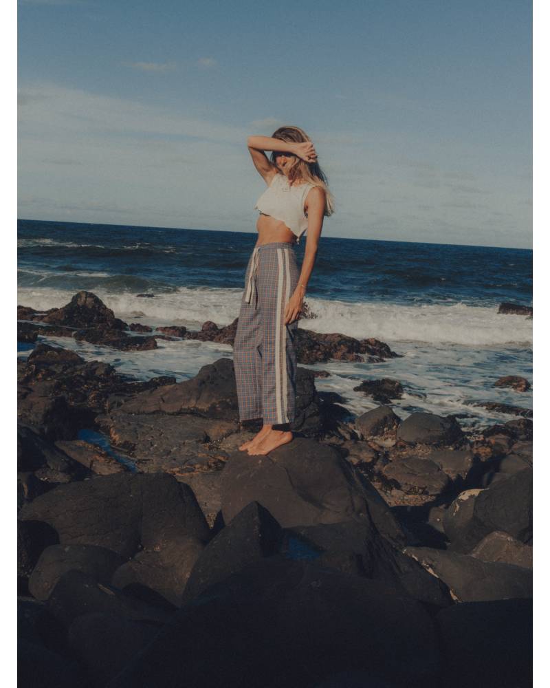 Flannel pants on rocks standing
