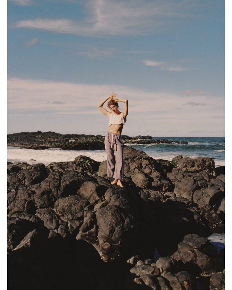 Flannel pants on rocks with sun